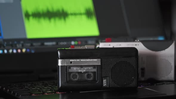 Record Audio on Mini Tape Recorder Against Laptop with Audio Recording Spectrum