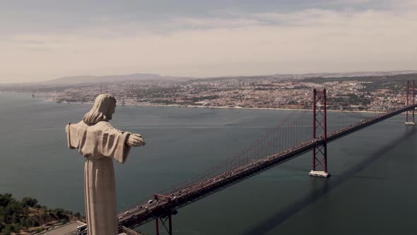 Sanctuary of Christ the King overlooking Tajo river and Lisbon cityscape. Pedestal down shot