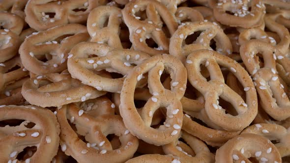 Pile of Pretzels Sprinkled with Sesame Rotate on a Turntable