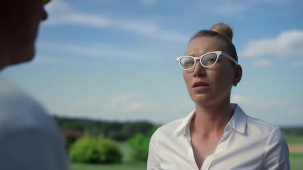 Woman Discuss Golf Leisure on Sunny Course Field