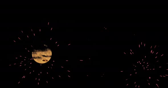 A firework in front of the Super full moon in the french sky