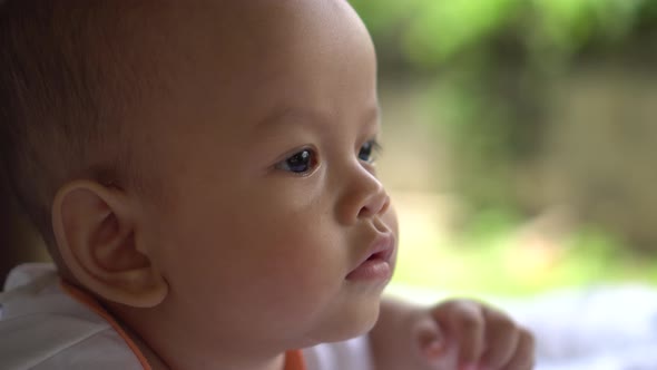 Happy portrait baby boy playing alone