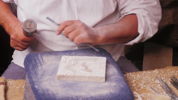 Craftsman Making Stone Fresco Closeup