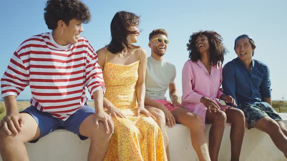 Group of friends having fun on the beach.