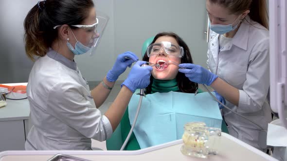 Dentist Using Water Syringe.