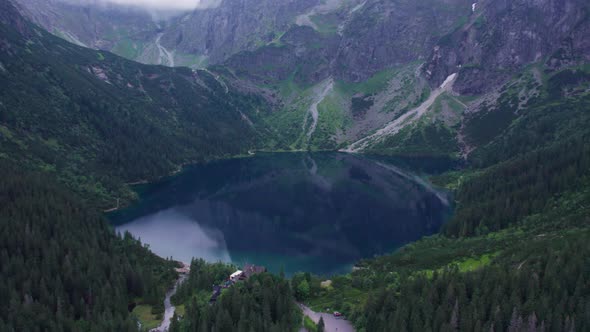 view of the blue mountain lake from a quadcopter morskie oko landmark of poland tatras buried europe