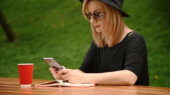 Hipster Girl Sitting In Park