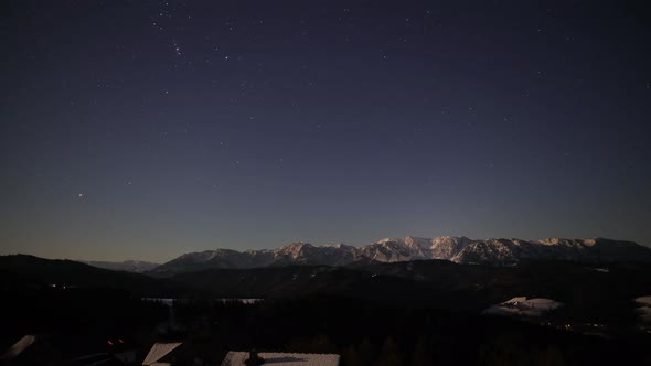 Nighttimelapse with Mountains, Stars and Snow