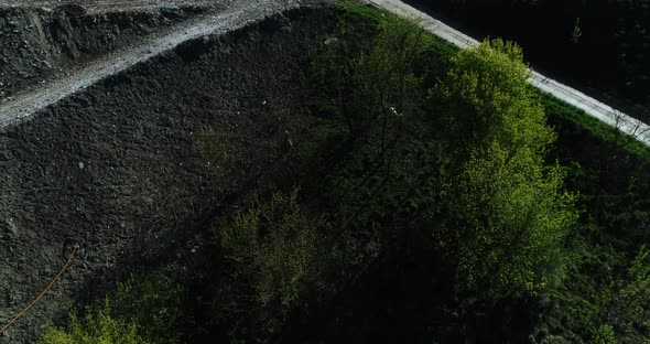 Drone flight over the garbage dump, camera moving forward.