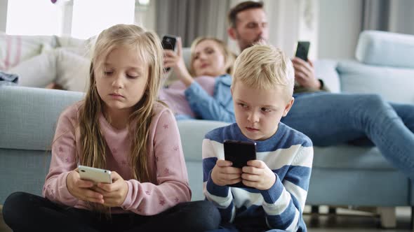 Handheld view of children using smart phone