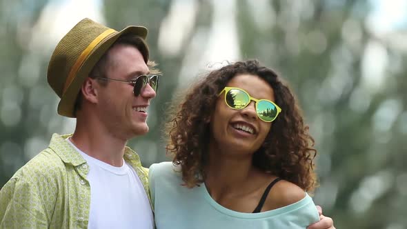 Young Couple Having Great Time at Outdoor Party, Hugging and Dancing Together