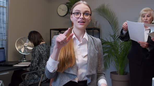 Portrait of Business Woman in Office Looking Camera Doing Phone Gesture Like Says Hey you Call Me