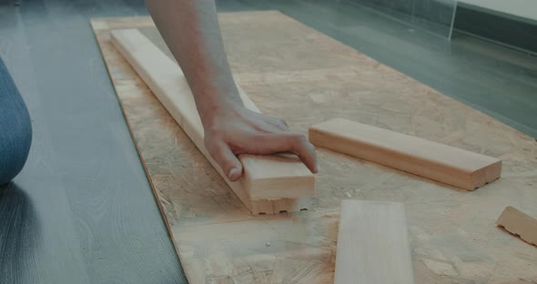 Man is Building Furniture Himself Making Renovation at Home