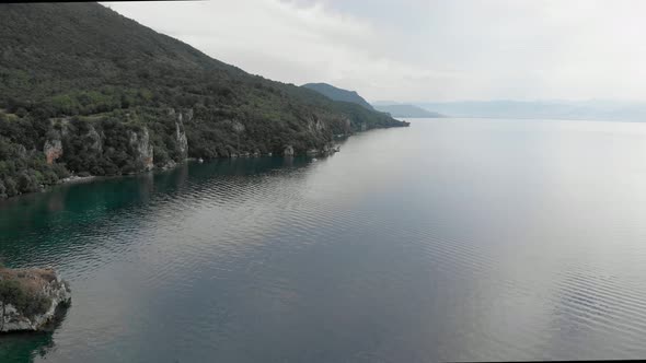 Aerial footage of summertime at Ohrid lake, Macedonia featuring the Church of St John at Kaneo. Beau