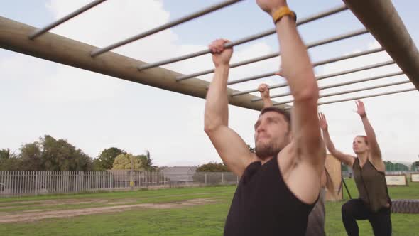 Young adults training at an outdoor gym bootcamp