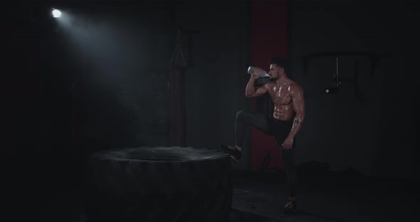 Strong Muscular Man Drinking Thirsty Water