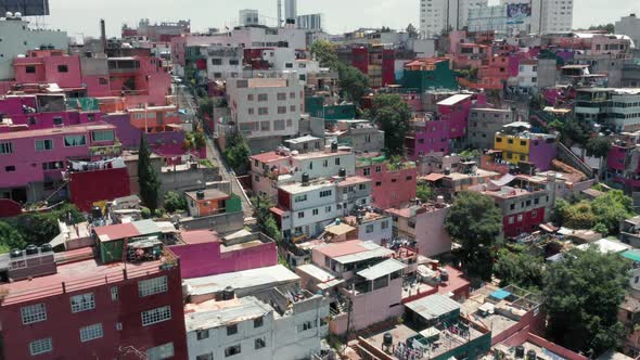  Aerial Over Colorful Pink Favelas in Mexico, Slum District Drone Panorama alt