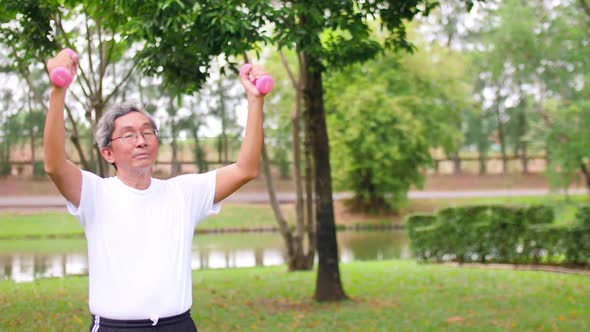 Asian senior man exercising in the park