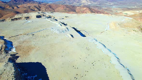 Aerial view over flat surface on a mountain peak in a desert landscape, Nevada