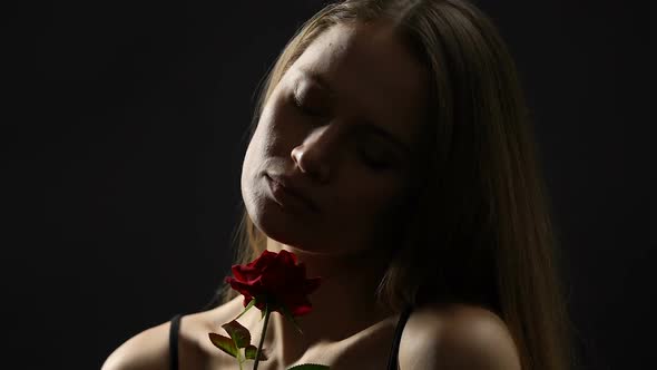 Self-Confident Feminine Female Stroking Skin With Rose, Seduction and Sexuality