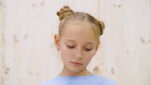 Portrait Sad Girl Teenager on Light Background in Studio