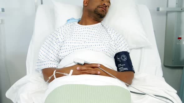 Male patient lying on bed