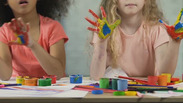 Funny Afro-American and Caucasian Kids with Painted Palms Having Fun at Workshop