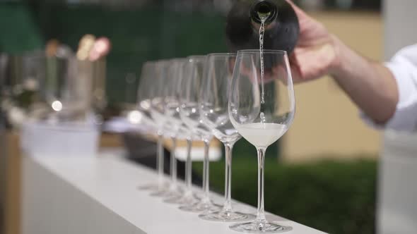 Pouring Champagne Into Glasses