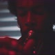 Close up of male musician playing the trumpet in a room with neon lights - VideoHive Item for Sale