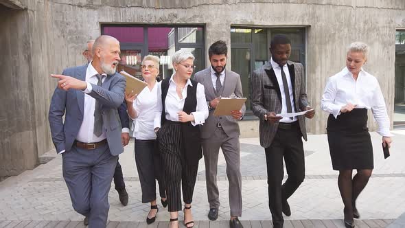 Group of Businessmen Walking Down the Street