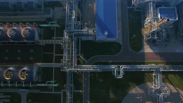 Morning Aerial Flying Panorama Over Chemical Plant Pipes and Cooling Towers with Fans. Smoke Smog