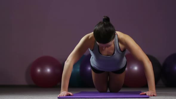 Female Athlete Doing Knee Push-Ups in Gym, Having Pain in Arm, Sports Injury