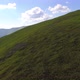 Aerial flight over green hill mountains. FPV Dynamic drone shot - VideoHive Item for Sale