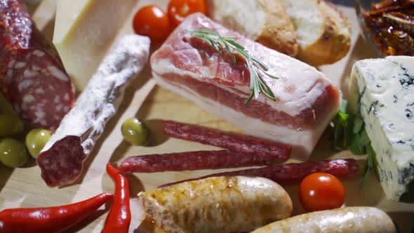 Beautifully Decorated Plates of Different Types Meat. Decorated with Condiments and Vegetables