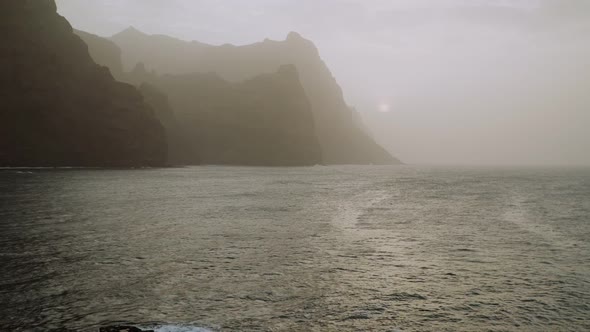 Amazing Silhouette of Huge Cliffs By Sunset in the Dust