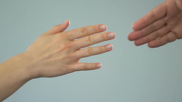 Man and Woman Holding Hands Gently, Happy Couple Togetherness Concept, Closeup