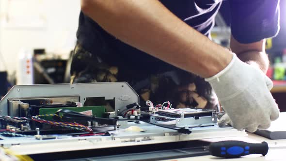 Professional Technician Detaches Monoblock Hard Drive Repairing It in Workshop