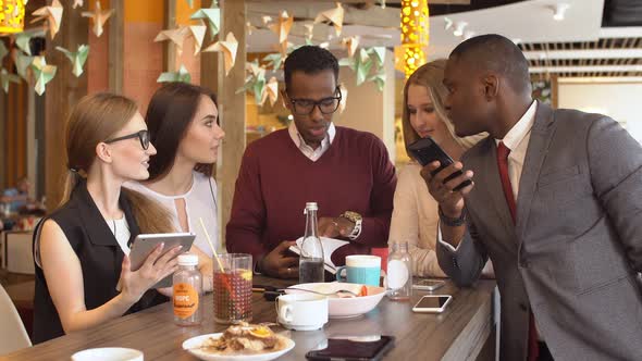 Business Team Having a Coffee Break During Their Meeting. The Meeting of Two Business