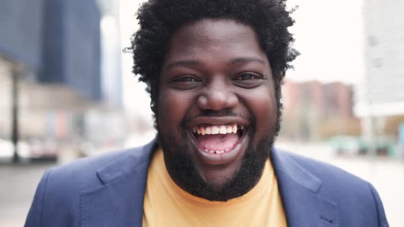 African Curvy Man Smiling on Camera Outdoor