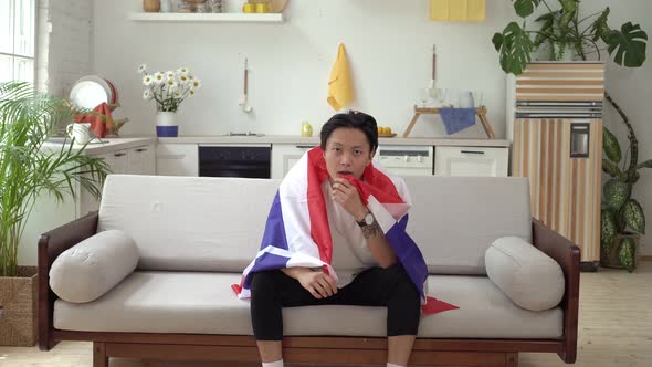 An Asian Man with the Flag of Thailand Supports the National Team