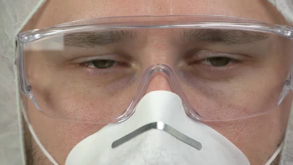 Close Up Young Man Wearing Glasses and Mask to Protect Himself From Virus Infection