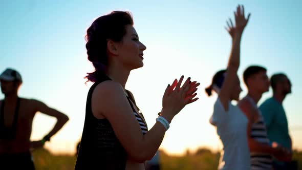 Woman Clapping Near Stage