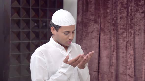 Indian Muslim man reading Namaz