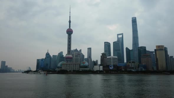 Shanghai Skyline and Boat Passes on the Huangpu River Timelapse Pan