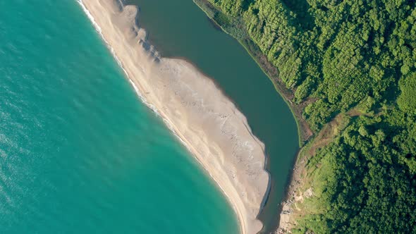 Exotic sandy beach surrounded by sea and river