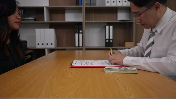 Businessman signing a contract paper and deal some business