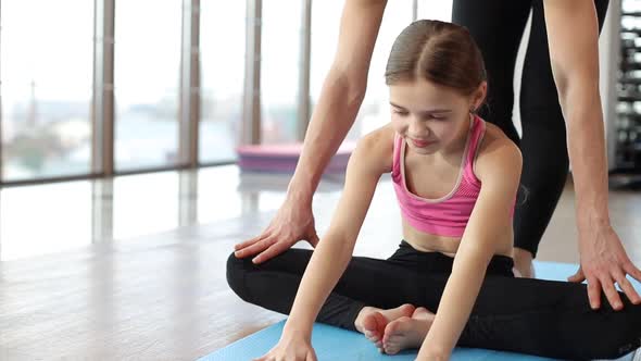 Mom and daughter do yoga, morning gymnastics, healthy lifestyle