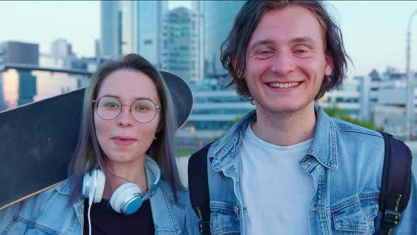 A Portrait of Young Man and Woman in Jeans Jackets in the City