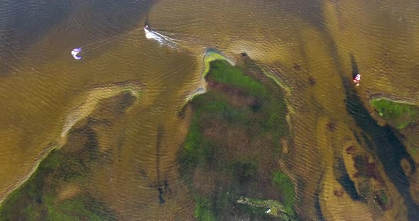 Aerial view of person kitesurfing on caiupe Lagoon in Brazil.