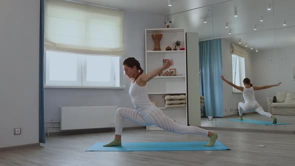 Young Woman Practicing Yoga in Studio